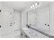 Bright bathroom with granite countertop, stylish fixtures, and a decorative mirror, designed for relaxation at 4175 River Run Cir, Hickory, NC 28602