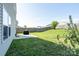 Spacious backyard features a well-maintained lawn, partial fence, and patio at 4315 Barnside Ln, Charlotte, NC 28216
