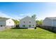Fenced backyard boasts a lush lawn, perfect for outdoor activities and relaxation at 4315 Barnside Ln, Charlotte, NC 28216