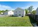 Backyard features a well-maintained lawn and a partial fence at 4315 Barnside Ln, Charlotte, NC 28216