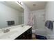 Bathroom with dual sinks, large mirror, and tub shower at 4315 Barnside Ln, Charlotte, NC 28216