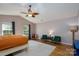 Spacious bedroom with two windows, seating area, and ceiling fan at 4315 Barnside Ln, Charlotte, NC 28216