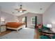 Large bedroom featuring vaulted ceiling, ceiling fan, two windows, and hardwood floors at 4315 Barnside Ln, Charlotte, NC 28216