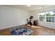 Bright bedroom features hardwood floors, neutral walls, and a large window for plenty of natural light at 4315 Barnside Ln, Charlotte, NC 28216