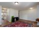 Bright open-plan living space featuring laminate flooring, neutral paint, and lots of natural light at 4315 Barnside Ln, Charlotte, NC 28216