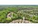 An aerial view highlights the neighborhood, showcasing mature trees and well-maintained landscaping at 476 Dudley Dr, Fort Mill, SC 29715