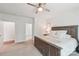 Bright bedroom with a ceiling fan, a wooden bed frame, and an ensuite bathroom at 476 Dudley Dr, Fort Mill, SC 29715