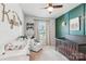 Charming Bedroom with a dark wood crib and a decorative accent wall at 476 Dudley Dr, Fort Mill, SC 29715