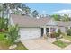 Charming single-story home features a two-car garage and inviting front porch at 476 Dudley Dr, Fort Mill, SC 29715