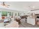 Open concept living room features a large sofa, hardwood floors, and recessed lighting at 476 Dudley Dr, Fort Mill, SC 29715