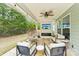 Cozy outdoor patio with comfortable seating and a mounted TV at 476 Dudley Dr, Fort Mill, SC 29715