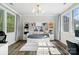 Stylish bedroom with built-in bookshelves, unique lighting fixture, and an abundance of natural light at 513 Sandbar Pt, Lake Wylie, SC 29710