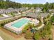 A bird's eye view of a community pool and playground, perfect for Gathering fun and recreation at 513 Sandbar Pt, Lake Wylie, SC 29710