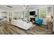 Inviting living room featuring a fireplace, hardwood floors, and bright natural light at 513 Sandbar Pt, Lake Wylie, SC 29710
