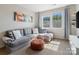 Cozy living room with comfortable seating, natural light, and stylish decor at 513 Sandbar Pt, Lake Wylie, SC 29710
