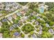 Aerial view of a neighborhood featuring mature trees, tennis courts, and a central park at 6728 Mimosa St, Indian Trail, NC 28079