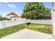 A fenced backyard featuring a well-maintained lawn and a small concrete patio at 6728 Mimosa St, Indian Trail, NC 28079