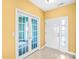 Bright entryway features French doors and modern white front door with sidelight at 6728 Mimosa St, Indian Trail, NC 28079