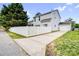 A two-story house with a driveway and a fenced backyard with a large tree at 6728 Mimosa St, Indian Trail, NC 28079