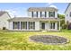 Beautiful two-story house featuring a well-maintained front yard and covered porch at 6728 Mimosa St, Indian Trail, NC 28079