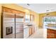 Well-equipped kitchen featuring stainless steel refrigerator, wooden cabinets, and a bright atmosphere at 6728 Mimosa St, Indian Trail, NC 28079