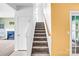 Carpeted staircase leading to the upper level of the home with natural light and easy access at 6728 Mimosa St, Indian Trail, NC 28079