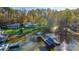 Aerial view of the property showcasing its waterfront location, private dock, and surrounding landscape with mature trees at 6778 Emerald Isle Dr, Sherrills Ford, NC 28673