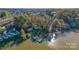 Aerial view showcasing waterfront homes, private docks, wooded landscape, and peaceful lake community at 6778 Emerald Isle Dr, Sherrills Ford, NC 28673