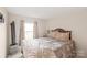 Cozy bedroom with a large bed, plush bedding, and natural light at 6778 Emerald Isle Dr, Sherrills Ford, NC 28673
