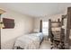 Well-lit bedroom with a single bed, desk, and ample storage space at 6778 Emerald Isle Dr, Sherrills Ford, NC 28673