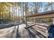 Open carport providing covered parking with ample space, complemented by a scenic wooded backdrop at 6778 Emerald Isle Dr, Sherrills Ford, NC 28673
