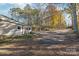 Side view featuring the home, driveway and wooded surroundings at 6778 Emerald Isle Dr, Sherrills Ford, NC 28673
