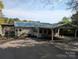 Charming single-story home with a covered carport and screened-in porch perfect for enjoying the outdoors at 6778 Emerald Isle Dr, Sherrills Ford, NC 28673