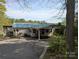 Charming single story home features a covered carport and screened in porch at 6778 Emerald Isle Dr, Sherrills Ford, NC 28673