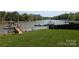 Expansive lake view with boathouses, blending natural beauty and convenient boating access at 6778 Emerald Isle Dr, Sherrills Ford, NC 28673
