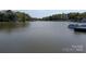 Scenic lake view with surrounding trees and waterfront homes showcasing the serene lakeside lifestyle at 6778 Emerald Isle Dr, Sherrills Ford, NC 28673