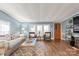 Cozy living room with natural light, featuring hardwood floors, plush seating, and neutral-toned decor at 6778 Emerald Isle Dr, Sherrills Ford, NC 28673