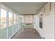 Relaxing screened porch with lake views, perfect for enjoying the outdoors in comfort at 6778 Emerald Isle Dr, Sherrills Ford, NC 28673