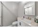 Bathroom featuring a white vanity with light countertop and a glass-enclosed shower at 7502 Hurstbourne Green Dr, Charlotte, NC 28277
