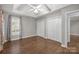 Large bedroom with tray ceiling, ceiling fan, and a walk-in closet at 7502 Hurstbourne Green Dr, Charlotte, NC 28277