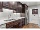 Kitchen with stainless steel appliances and dark cabinets at 7502 Hurstbourne Green Dr, Charlotte, NC 28277