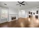 Spacious living room offering a fireplace, hardwood floors, and an open concept layout at 7502 Hurstbourne Green Dr, Charlotte, NC 28277