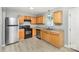 Functional kitchen featuring modern appliances, wood cabinetry, and ample counter space at 7507 Holly Grove Ct, Charlotte, NC 28227