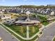 Aerial view of the community clubhouse and surrounding homes; landscaping and parking visible at 797 Latrobe Dr, Iron Station, NC 28080