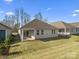 Spacious backyard featuring a well-maintained lawn and a charming patio area at 797 Latrobe Dr, Iron Station, NC 28080