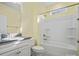 Bright bathroom featuring granite countertops, white cabinets, and a shower-tub combination at 797 Latrobe Dr, Iron Station, NC 28080