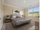 Cozy bedroom with neutral tones, a large window with backyard view, and modern decor for a peaceful retreat at 797 Latrobe Dr, Iron Station, NC 28080