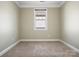 Neutral bedroom features neutral paint, carpet, crown molding and a window with natural light at 797 Latrobe Dr, Iron Station, NC 28080