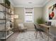 Bright home office space with stylish shelving, large window, comfortable seating, and a work desk at 797 Latrobe Dr, Iron Station, NC 28080