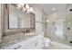 Modern bathroom featuring a glass-enclosed shower and granite countertop at 802 Capington Ln, Waxhaw, NC 28173